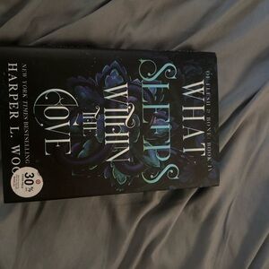 What She Feeds Within the Cove Hardcover Book - Teal & Black Cover